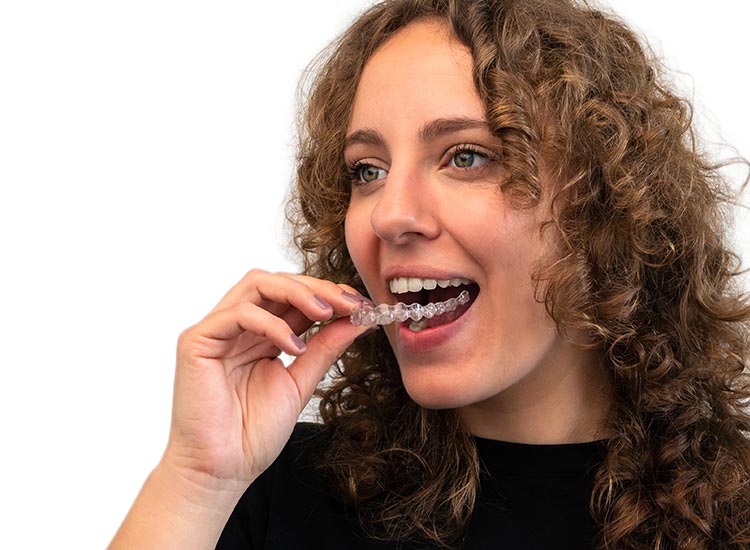 person putting on Invisalign