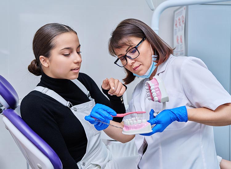 patient showing dentist brushing patterns