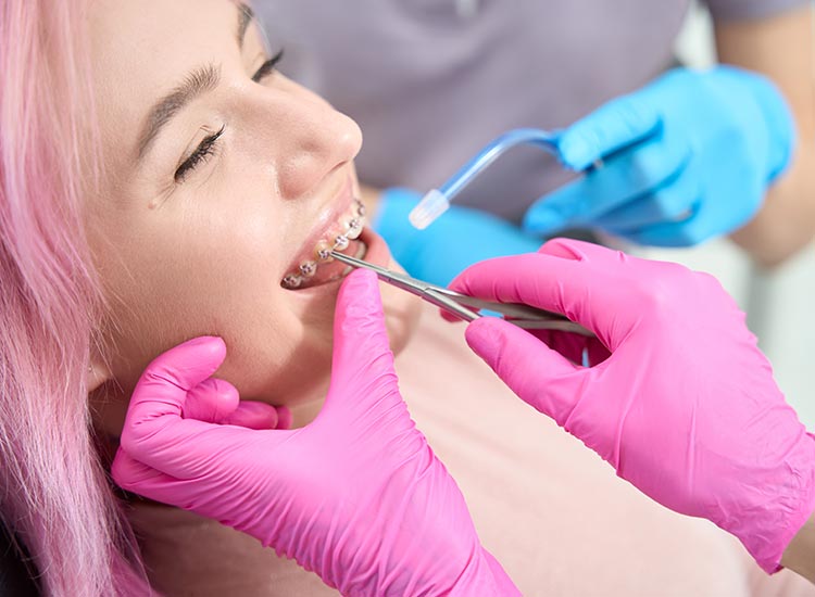 dentist working on patients braces