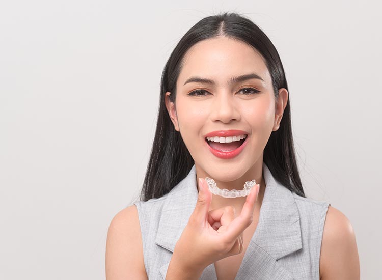 person smiling with Invisalign
