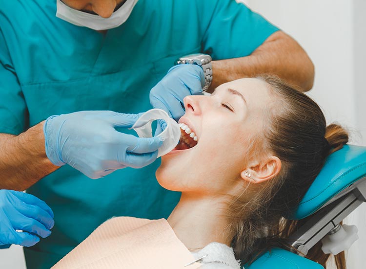 patient receiving a dental exam