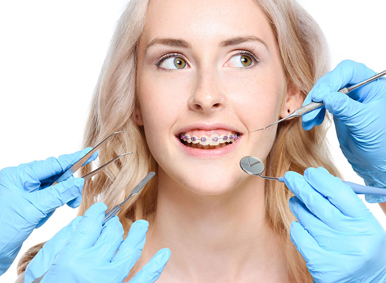 patient with dental tools around them