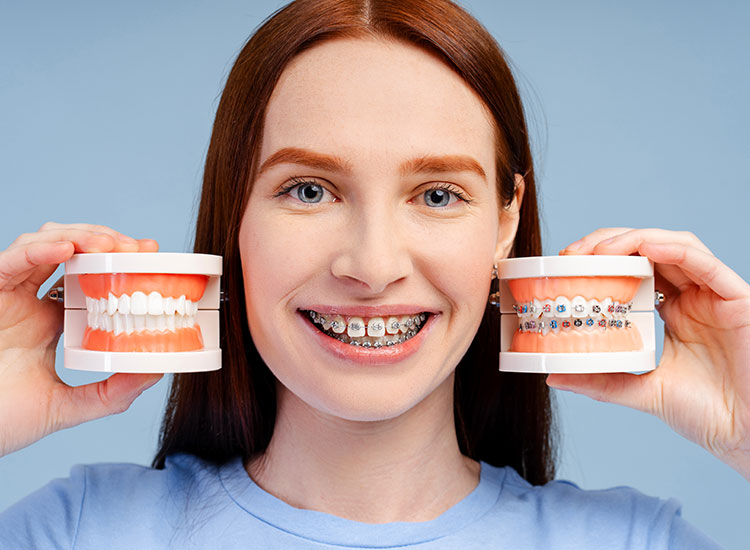 patient with two teeth models