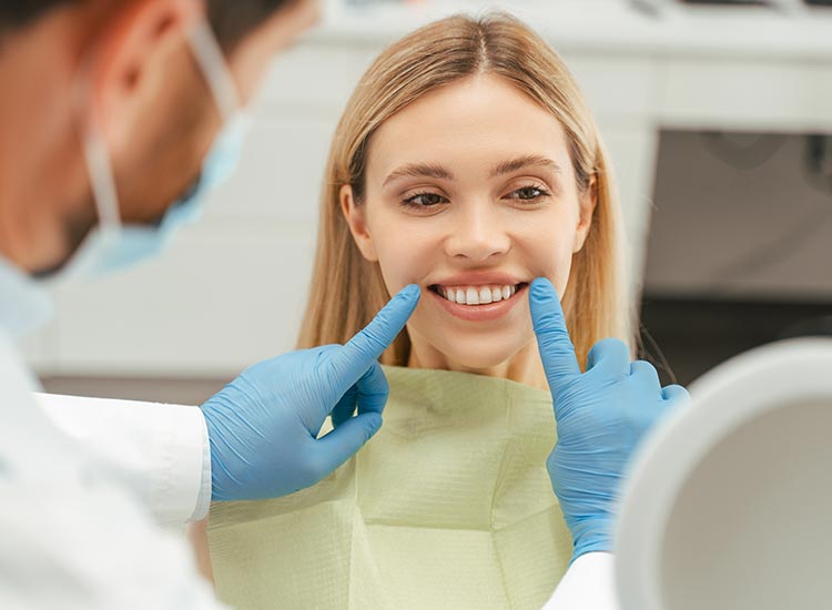 dentist examining patients smile