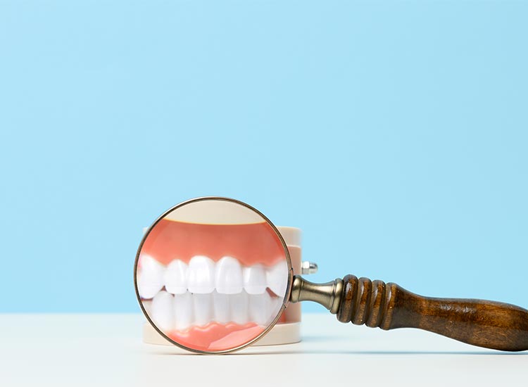magnifying glass showing closeup of teeth