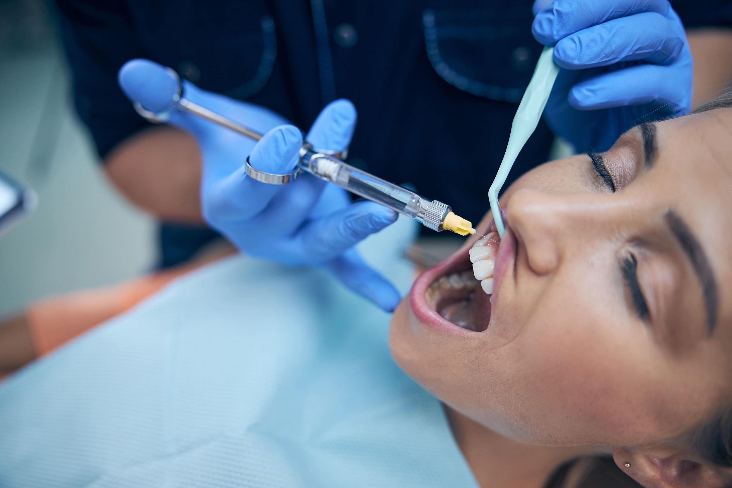 dentist doing injection on patient