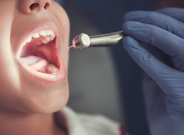 dentist checking inside patients mouth