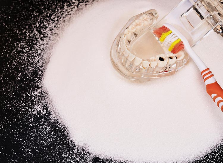 teeth model with baking soda around it