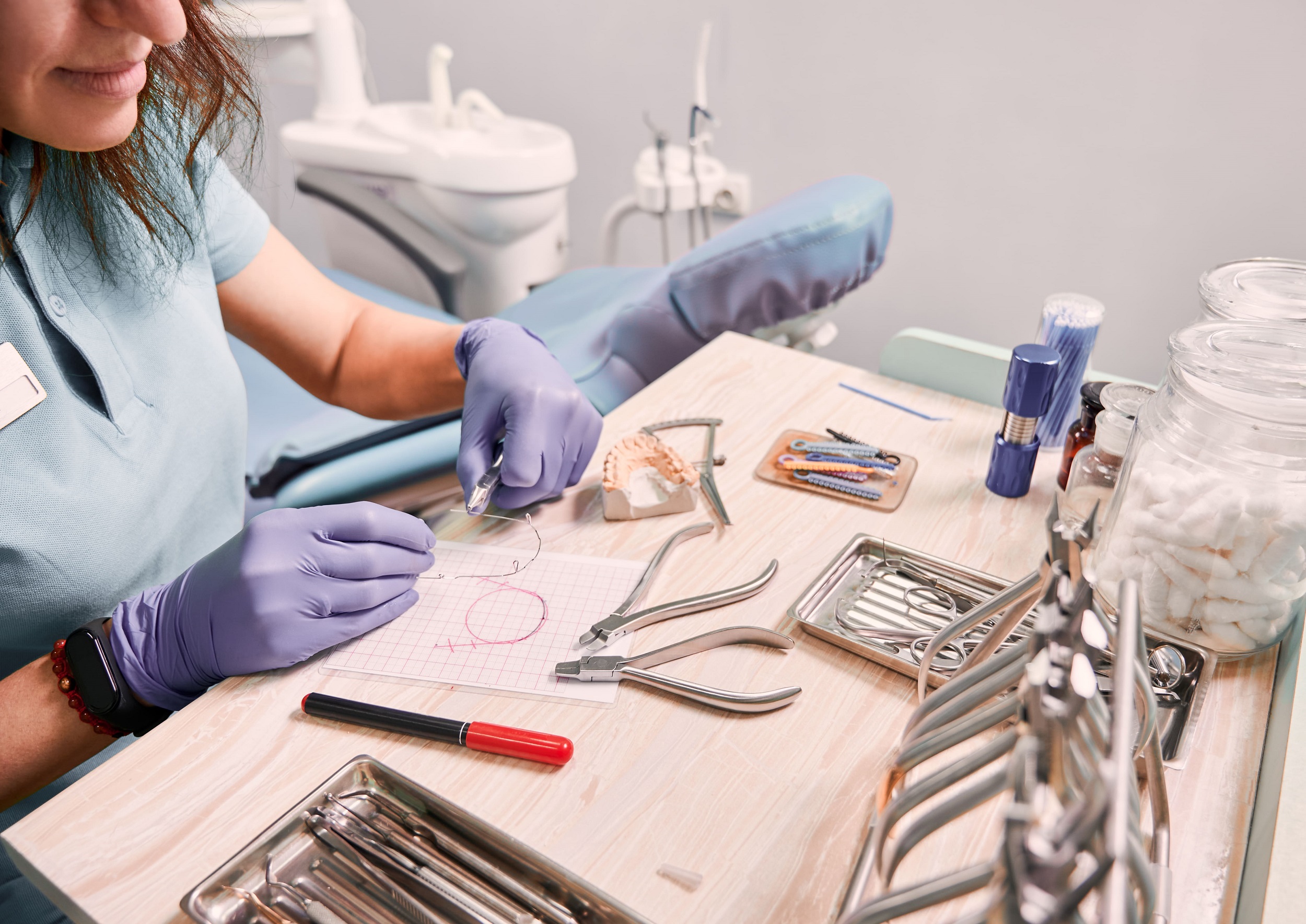 orthodontist working in dental office