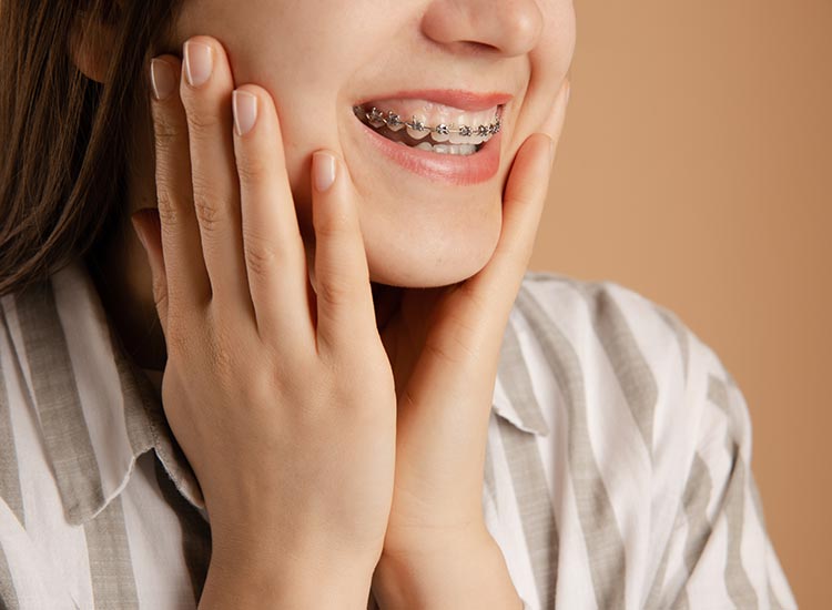 person smiling with braces