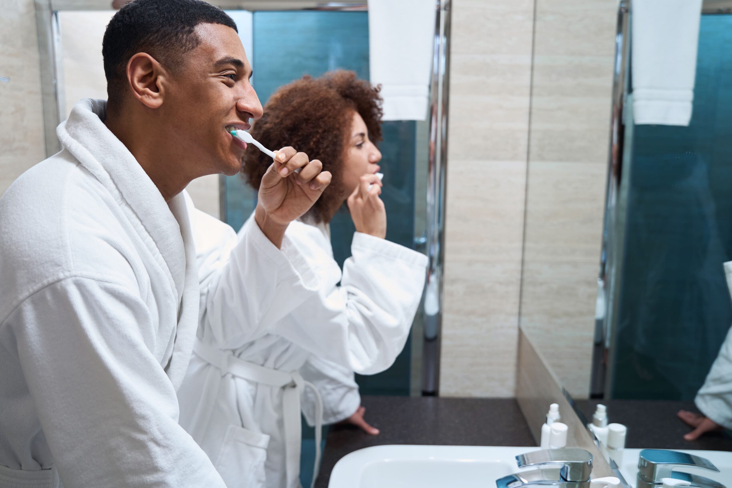 couple brushing teeth together