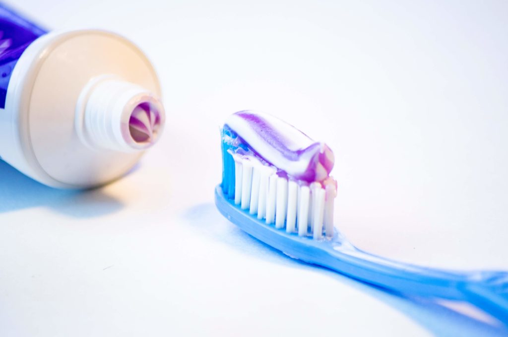 toothbrush with tooth paste on it