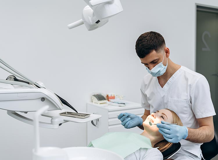 dental assistant working on patient