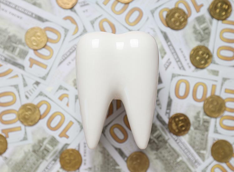 tooth with money behind it