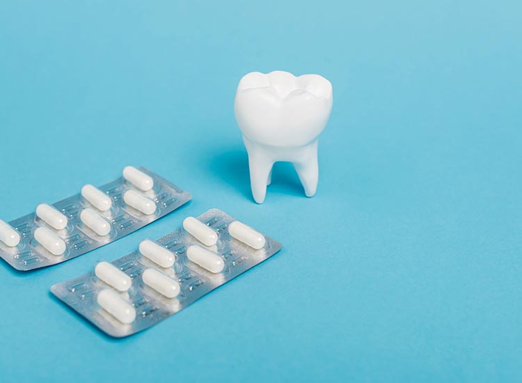 tooth next to vitamin