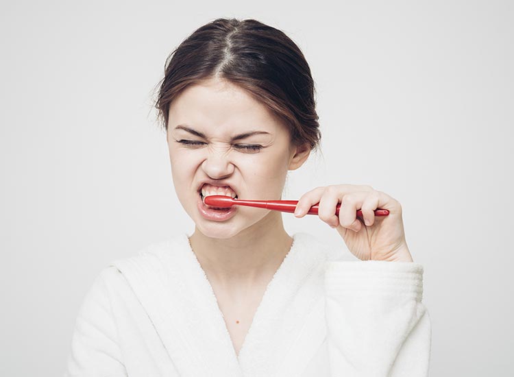 person brushing their teeth