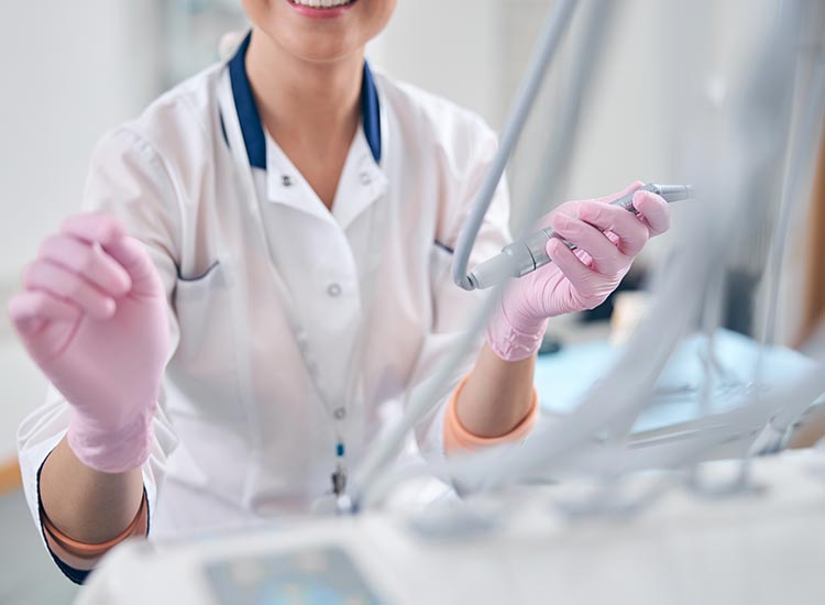 dentist with dental tools