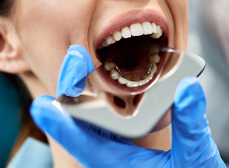dentist checking patients braces