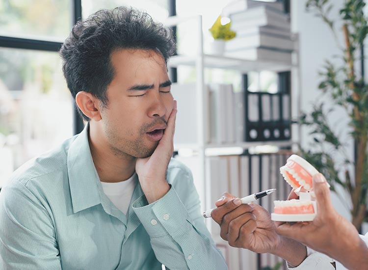 person expressing tooth pain