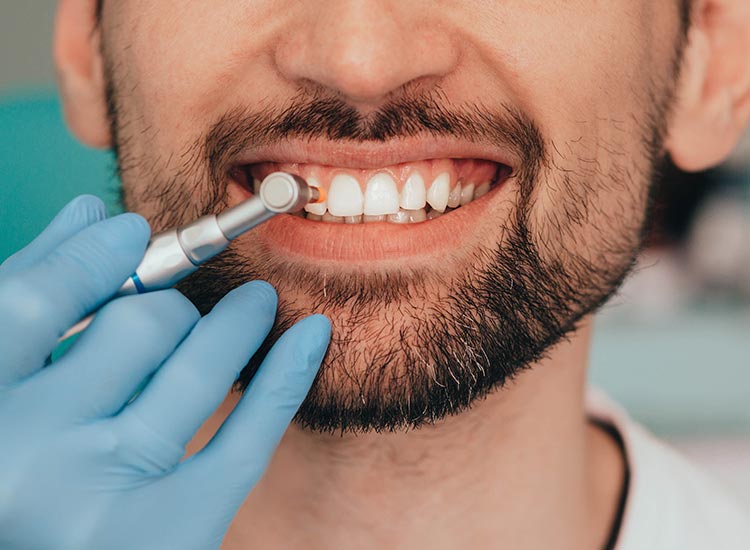 dentist checking patients gums